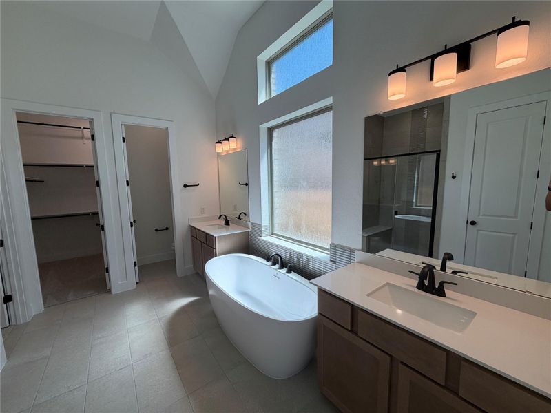 Primary Bath retreat with dual vanities, soaking tub
