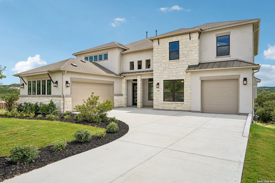 Front exterior of a new home in Verandas at the Rim, San Antonio, TX, highlighting curb appeal (Image 2). Front exterior of a new home in Verandas at the Rim, San Antonio, TX, highlighting curb appeal (Image 2).