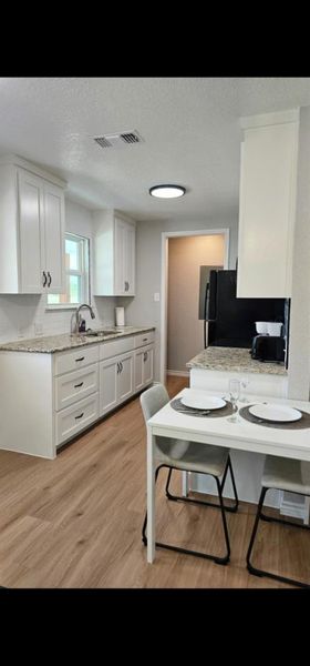 View from the living room into the gallery full size kitchen. All new full size appliances convey. View from the living room into the gallery full size kitchen. All new full size appliances convey.