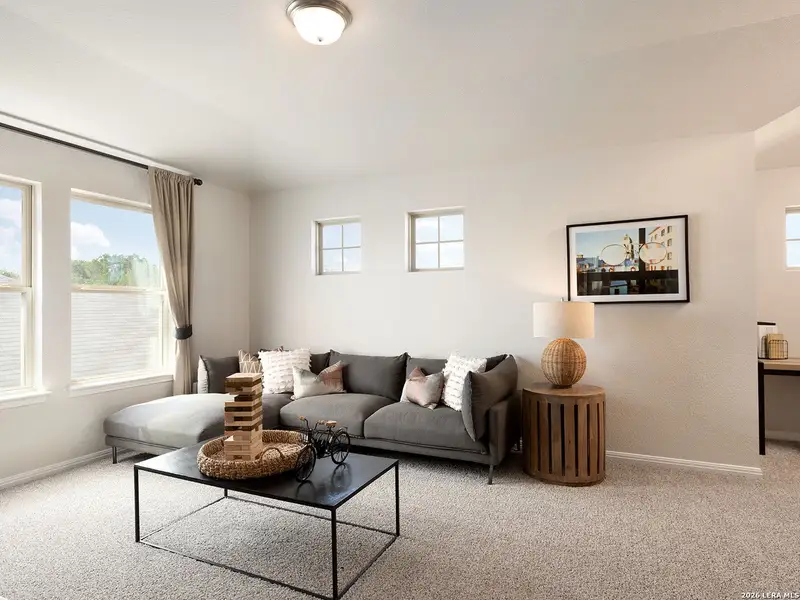 Furnished interior view inside a new home in Estancia Ranch - Premier Series, San Antonio (Image 6).
