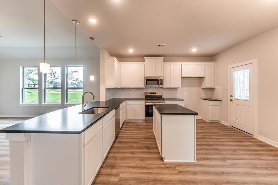 Furnished interior view inside a new home in Deer Pines, Conroe (Image 7).