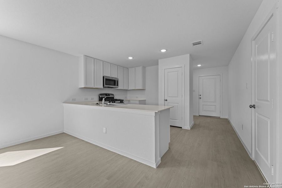 Furnished interior view inside a new home in Lodi Grove, Floresville (Image 7).