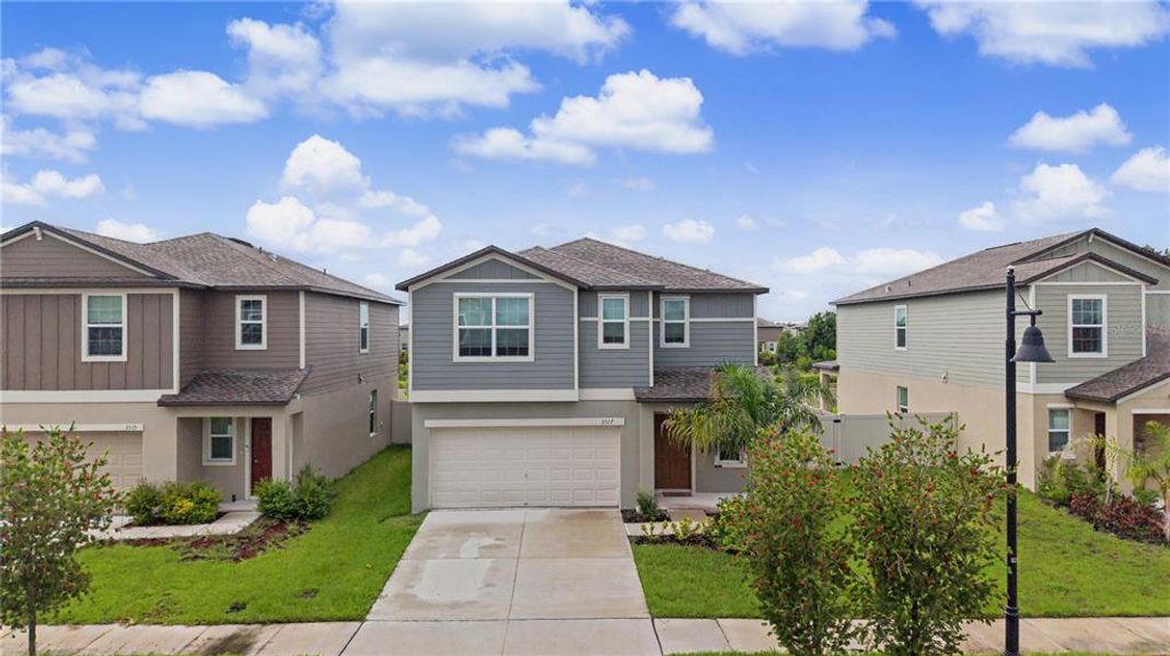 Front exterior of a new home in Park East, Plant City, FL, highlighting curb appeal (Image 23).