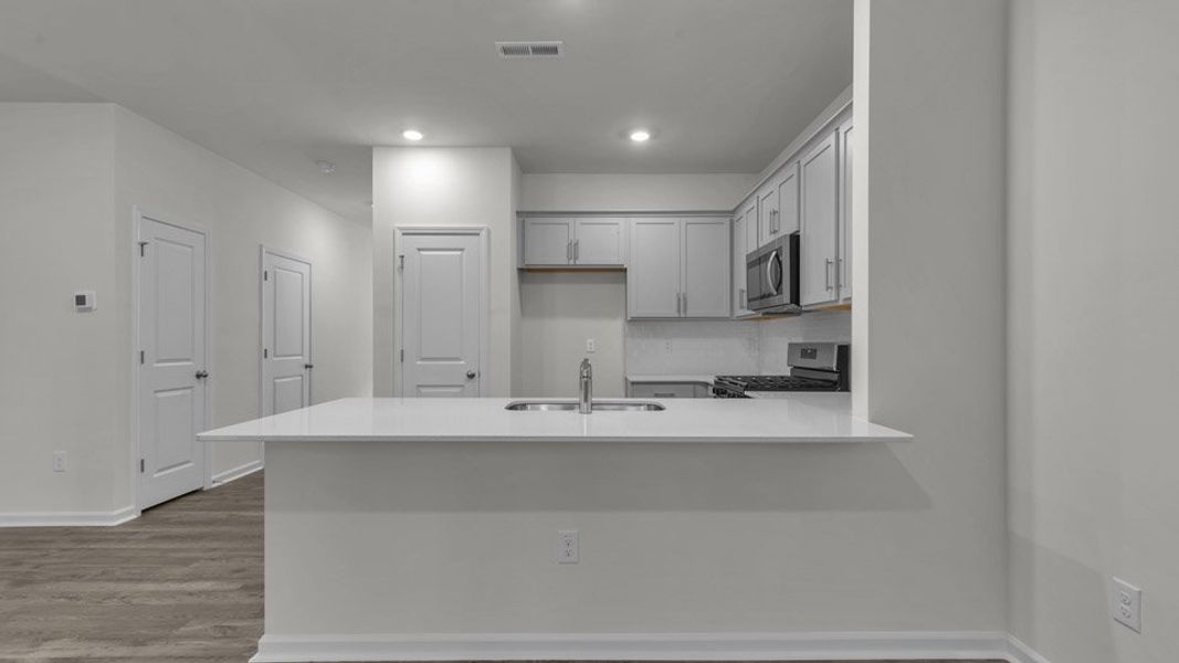 Furnished interior view inside a new home in The Townes at Bexford, Willow Spring (Image 5). Furnished interior view inside a new home in The Townes at Bexford, Willow Spring (Image 5).