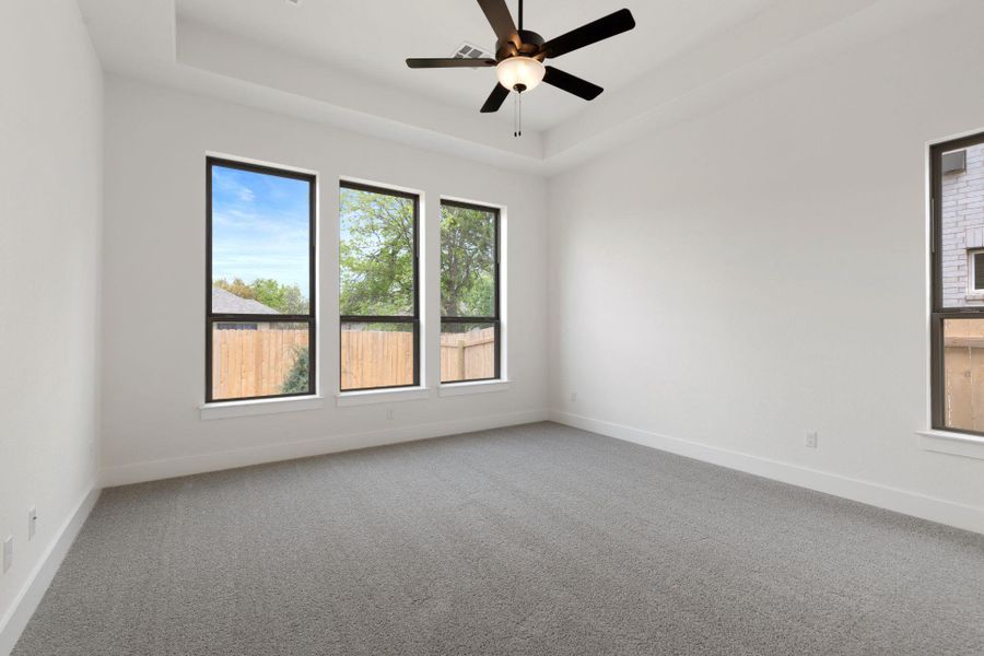 Primary Bedroom with elevated ceiling Primary Bedroom with elevated ceiling