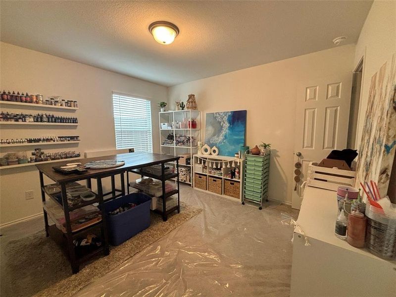 Dining space with baseboards and a textured ceiling