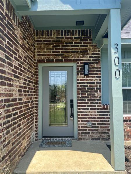 Property entrance with brick siding. Property entrance with brick siding.