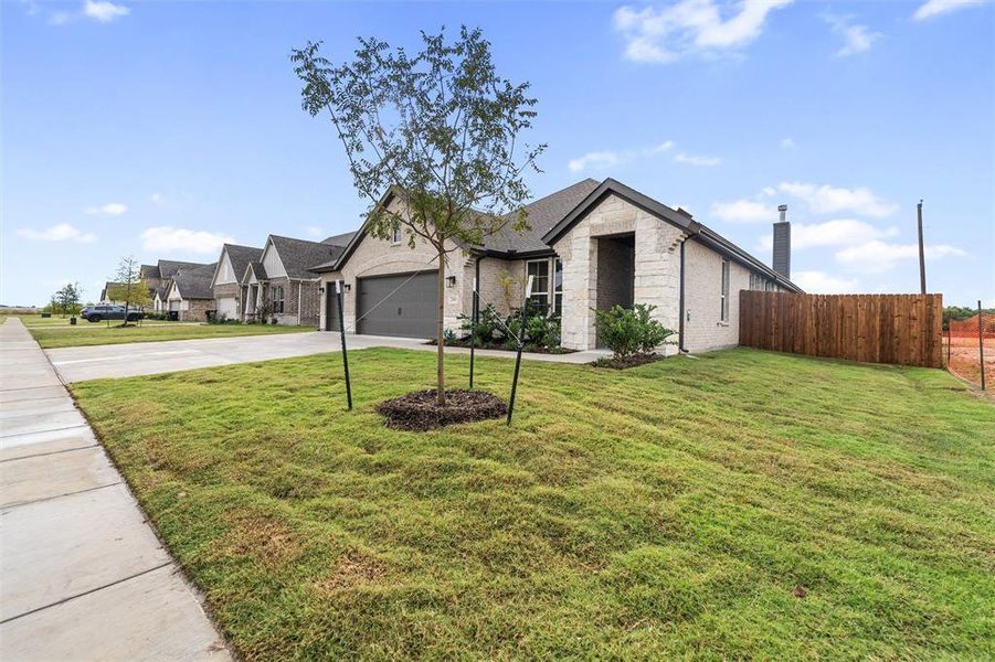View of front of house with brick siding, concrete driveway, and a garage View of front of house with brick siding, concrete driveway, and a garage