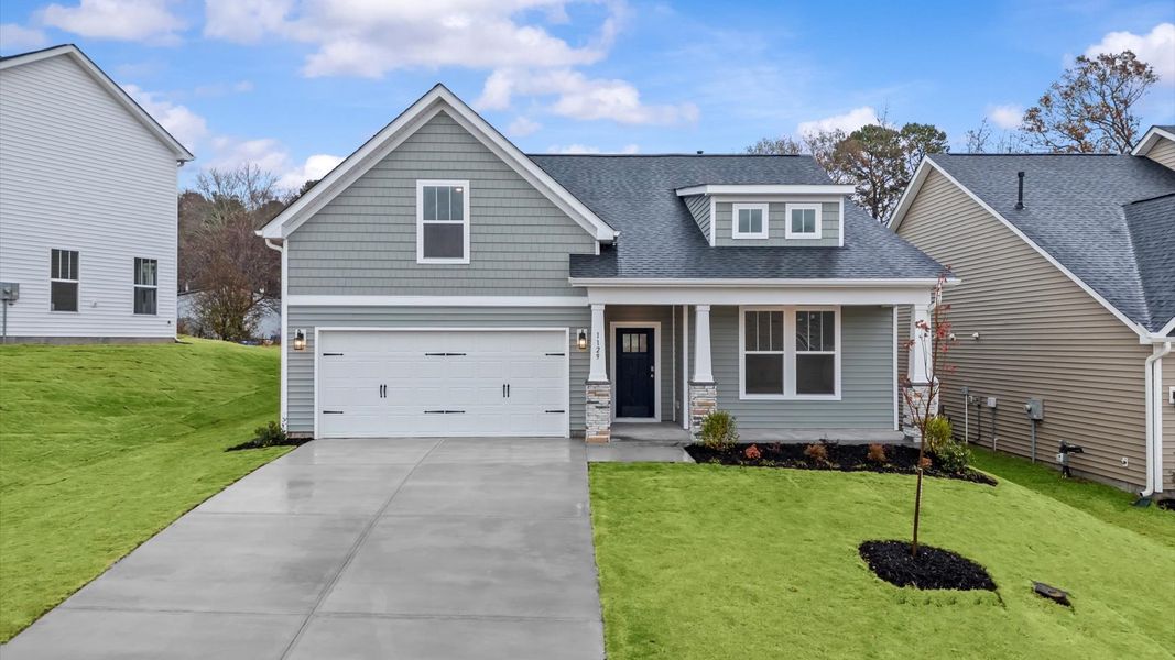 Front exterior of a new home in Iris Meadows, Moore, SC, highlighting curb appeal (Image 1).