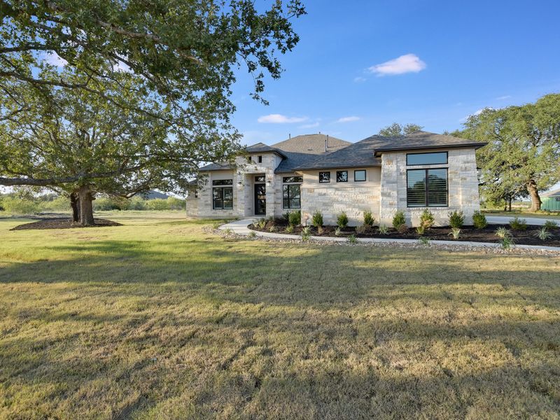 Representative exterior photo of a completed home built from the San Simeon I by Giddens Homes in Clearwater Ranch, Liberty Hill, TX (Image 28).