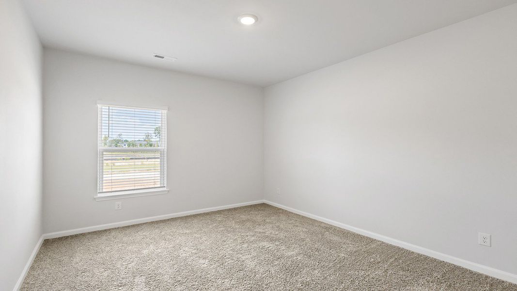 Spacious, unfurnished interior of a new home in The Crossing at St. James, Summerville (Image 21).