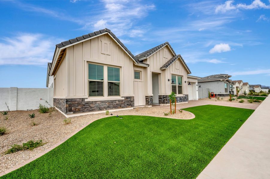 Front exterior of a new home in Escena at Blossom Rock, Apache Junction, AZ, highlighting curb appeal (Image 23).