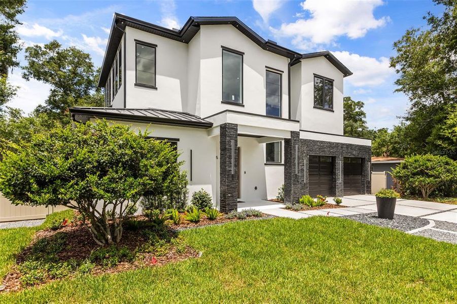 Front exterior of a new home in , Winter Park, FL, highlighting curb appeal (Image 25).