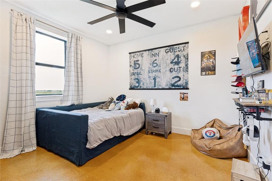 Neutral wall tones, recessed lighting, and a dark-toned ceiling fan highlight this space Neutral wall tones, recessed lighting, and a dark-toned ceiling fan highlight this space
