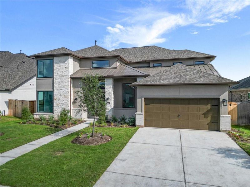 Front exterior of a new home in Jordan Ranch 70′ Lots, Fulshear, TX, highlighting curb appeal (Image 2). Front exterior of a new home in Jordan Ranch 70′ Lots, Fulshear, TX, highlighting curb appeal (Image 2).