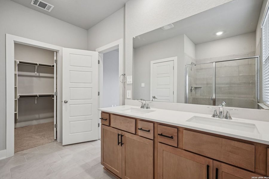 Furnished interior view inside a new home in Estancia Ranch - Premier Series, San Antonio (Image 18).