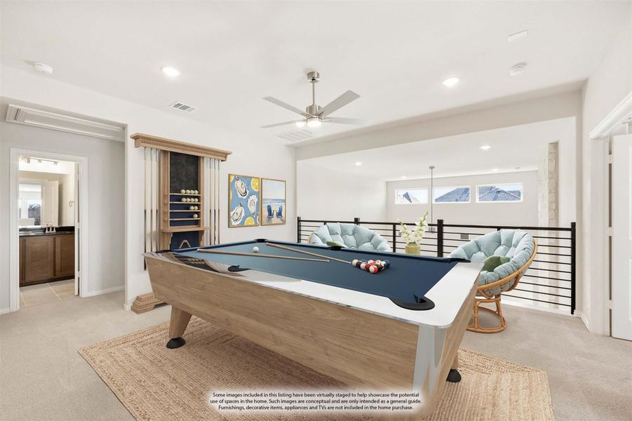 Game room with pool table, cue rack, ceiling fan, and open railing overlooking lower level Game room with pool table, cue rack, ceiling fan, and open railing overlooking lower level