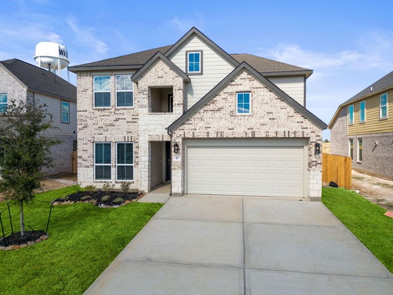 Front exterior of a new home in Beacon Hill, Waller, TX, highlighting curb appeal (Image 15). Front exterior of a new home in Beacon Hill, Waller, TX, highlighting curb appeal (Image 15).