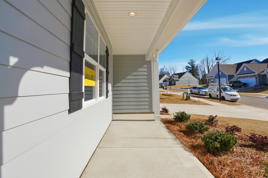 Exterior details and patio area of a home in Villas at Prestwick, Mooresville (Image 26).