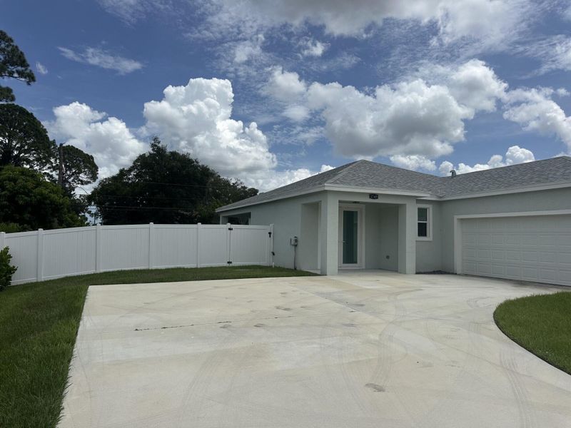 Front exterior of a new home in , Port St. Lucie, FL, highlighting curb appeal (Image 19).