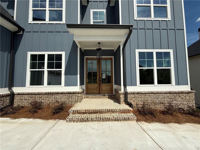 Front exterior of a new home in , Jefferson, GA, highlighting curb appeal (Image 28).