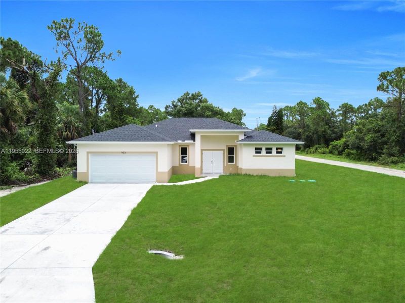 Front exterior of a new home in , Lehigh Acres, FL, highlighting curb appeal (Image 28).