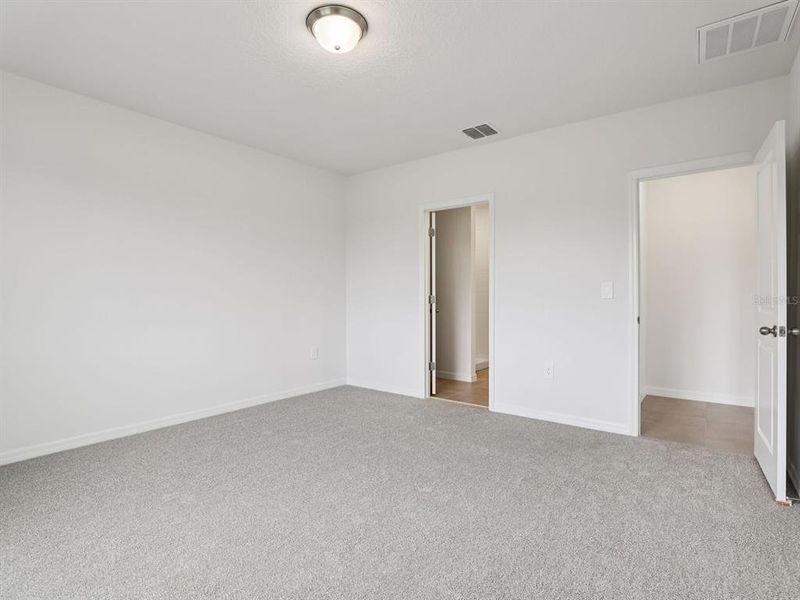 Spacious, unfurnished interior of a new home in The Grove at Stuart Crossing - Classic Series, Bartow (Image 9).