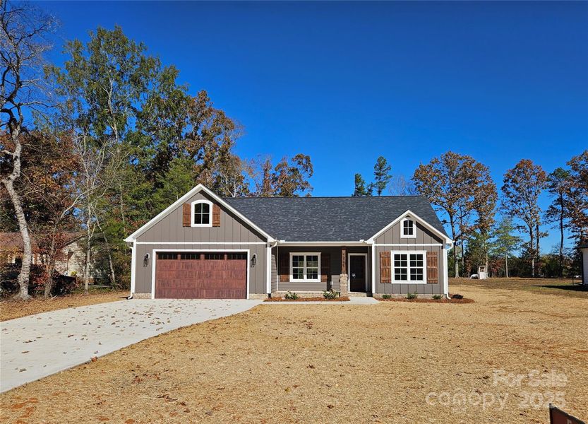 Front exterior of a new home in , Midland, NC, highlighting curb appeal (Image 15).