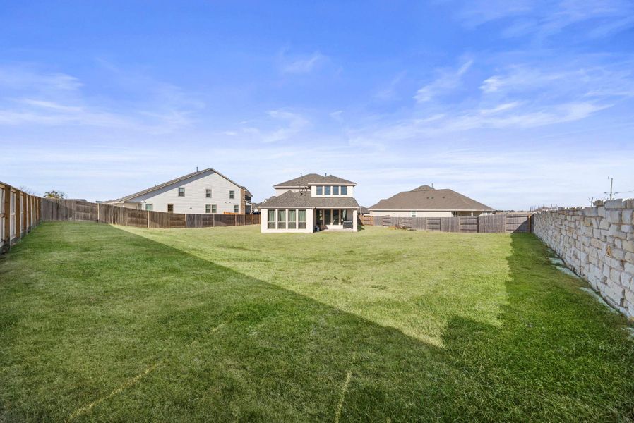 Fenced backyard featuring a patio area