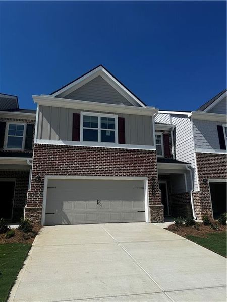 Front exterior of a new home in Park Center Pointe, Austell, GA, highlighting curb appeal (Image 1).