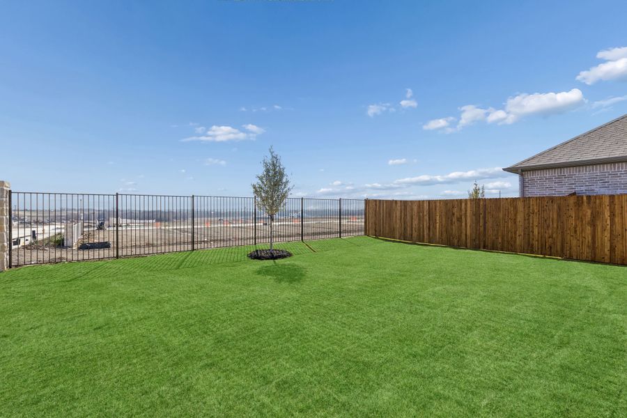 Backyard in a Nicholson Ranch Magnolia Model Home in Lavon TX by Trophy Signature Homes