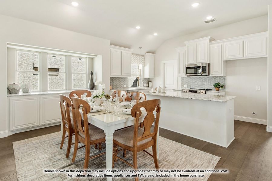Open dining area with white table and wood chairs next to kitchen with white cabinets and granite countertops Open dining area with white table and wood chairs next to kitchen with white cabinets and granite countertops
