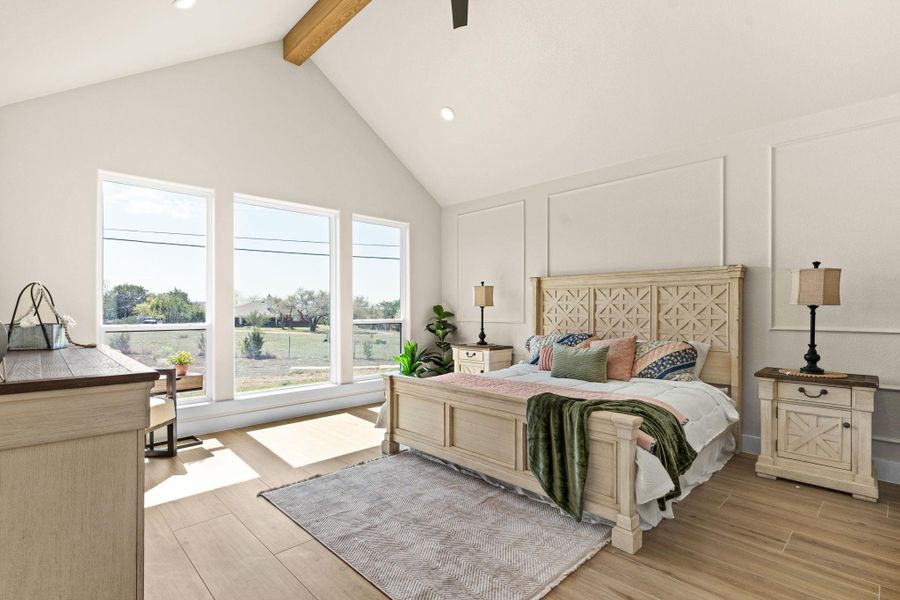 Bedroom featuring beam ceiling, high vaulted ceiling, light wood finished floors, and recessed lighting Bedroom featuring beam ceiling, high vaulted ceiling, light wood finished floors, and recessed lighting