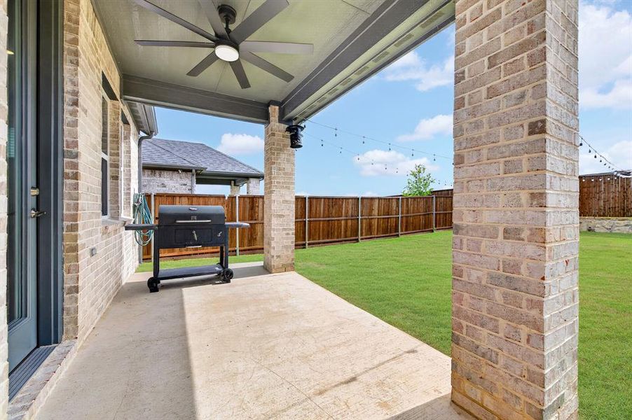Exterior details and patio area of a home in South Oak, Lakewood Village (Image 3).