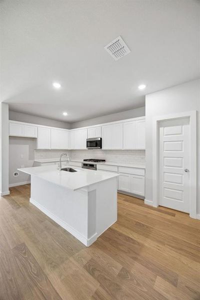 Kitchen in the Oscar home plan by Trophy Signature Homes – REPRESENTATIVE PHOTO Kitchen in the Oscar home plan by Trophy Signature Homes – REPRESENTATIVE PHOTO
