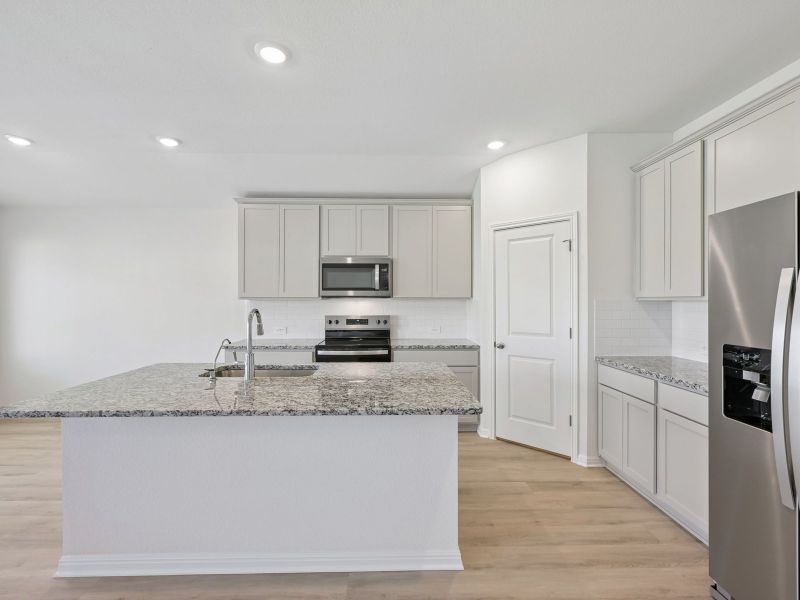Furnished interior view inside a new home in Creekfall, Burnet (Image 5).