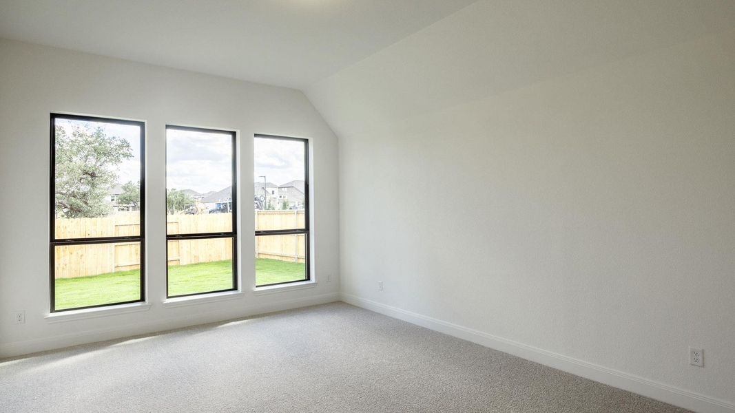 Bonus room featuring carpet and lofted ceiling Bonus room featuring carpet and lofted ceiling