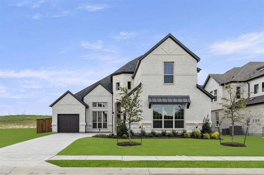 Front exterior of a new home in Breezy Hill, Rockwall, TX, highlighting curb appeal (Image 23).