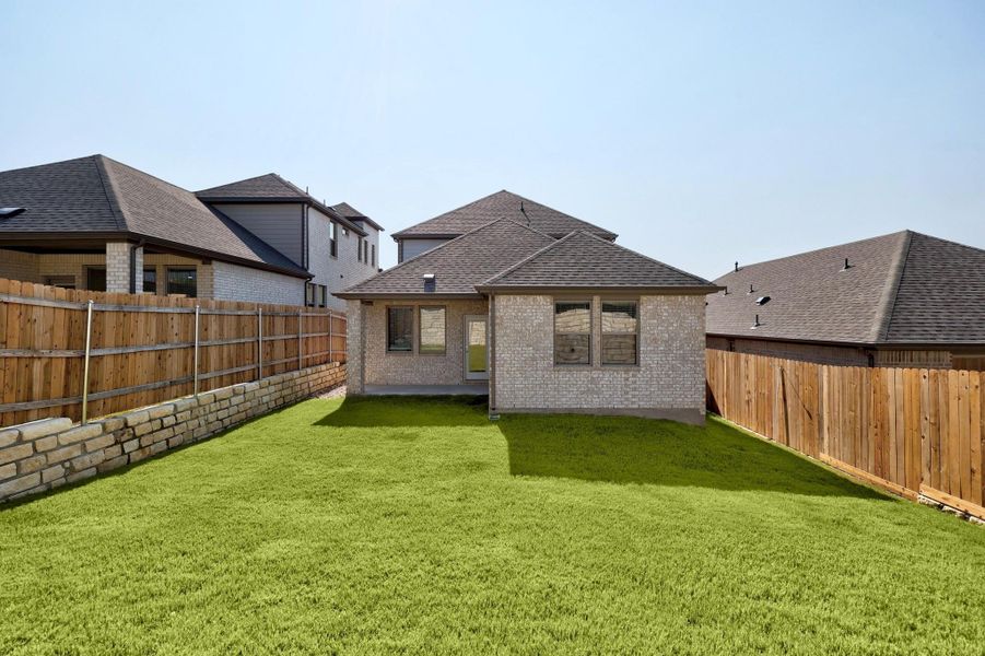 Exterior details and patio area of a home in Lakeside at Tessera, Lago Vista (Image 19).
