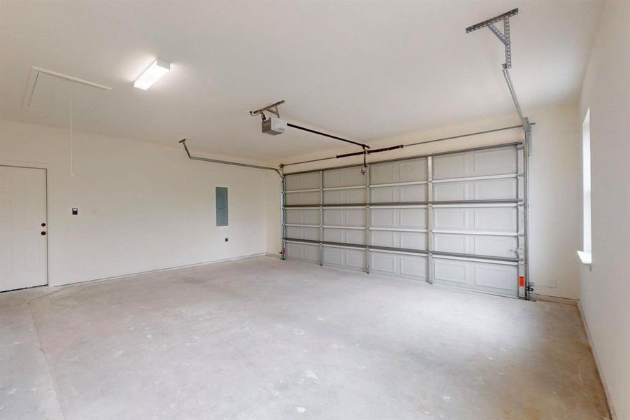 Garage with electric panel and a garage door opener