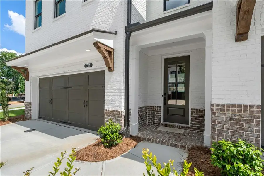 Exterior details and patio area of a home in Millcroft Townhomes, Buford (Image 28).