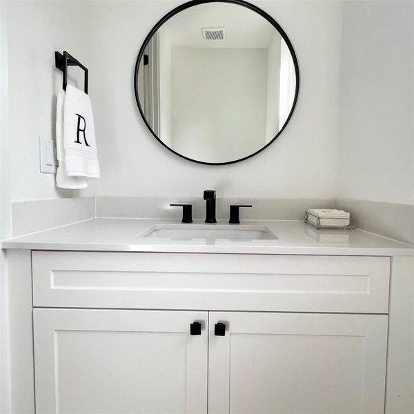 Sleek and classic design make this one luxurious powder room. Sleek and classic design make this one luxurious powder room.
