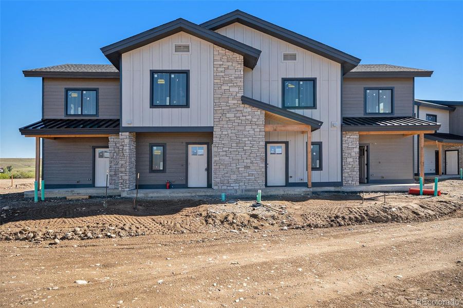 Front exterior of a new home in , Granby, CO, highlighting curb appeal (Image 7).