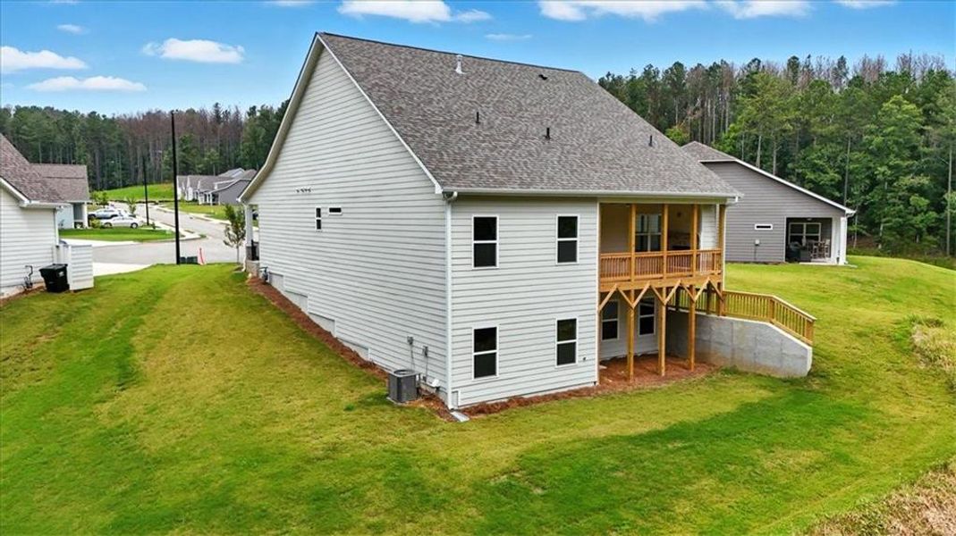 Front exterior of a new home in Stratford at NatureWalk, Dallas, GA, highlighting curb appeal (Image 22). Front exterior of a new home in Stratford at NatureWalk, Dallas, GA, highlighting curb appeal (Image 22).