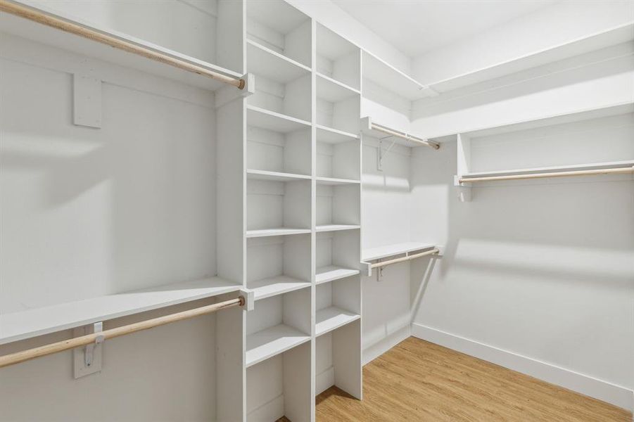 Walk in closet featuring light wood-type flooring