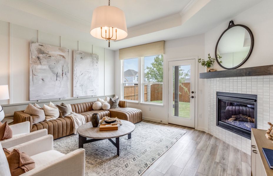 Gathering room with large windows and tray ceiling