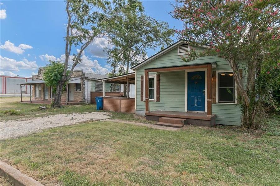 Bungalow-style house with a front lawn and covered porch Bungalow-style house with a front lawn and covered porch