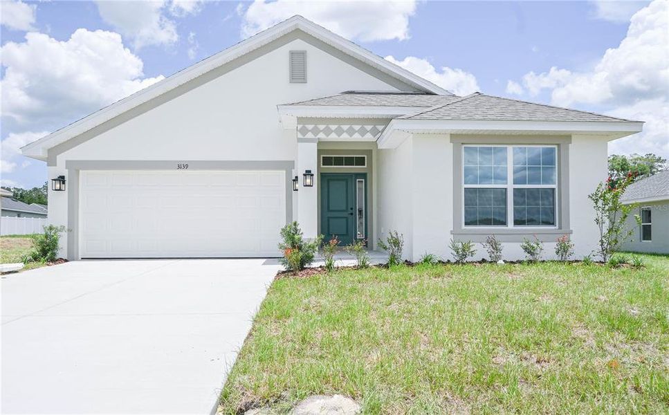 Front exterior of a new home in , Ocala, FL, highlighting curb appeal (Image 1). Front exterior of a new home in , Ocala, FL, highlighting curb appeal (Image 1).
