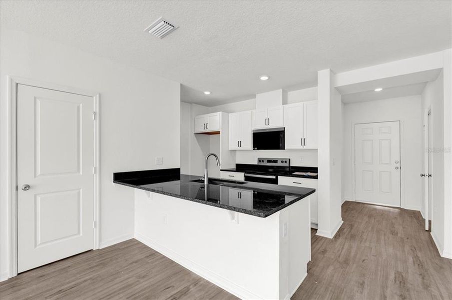 Furnished interior view inside a new home in Reserve at Forest Lake Townhomes, Lake Wales (Image 6).