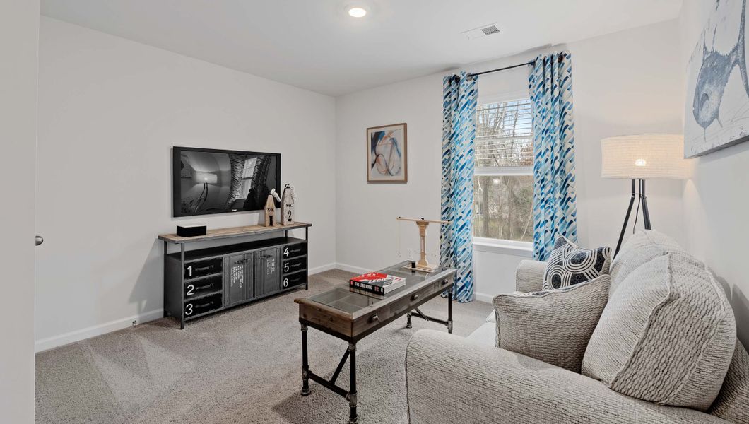 Furnished interior view inside a new home in Bentley Park, Greenwood (Image 26).